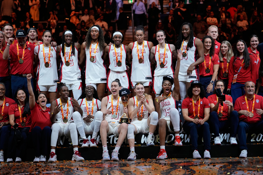 United States team poses with medals after winning the Women's Basketball World Cup final match between the United States and France in Berlin, Sunday, Sept. 13, 2026. (AP Photo/Ebrahim Noroozi)