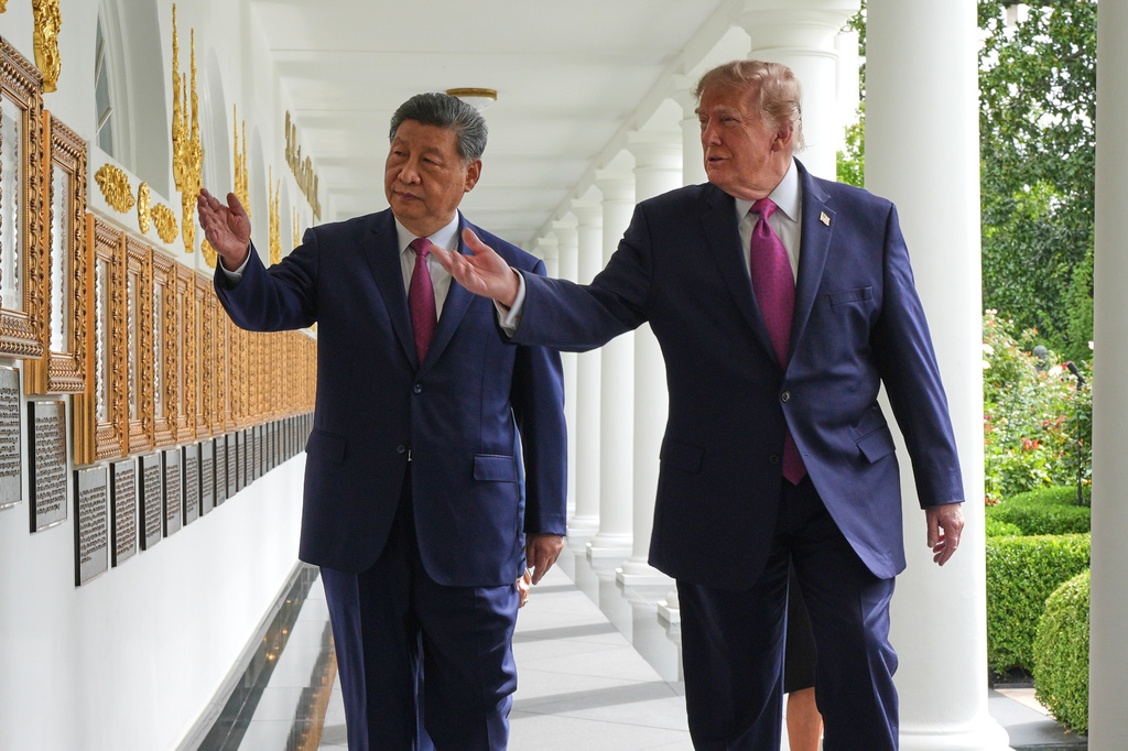 President Donald Trump and China's President Xi Jinping walk along the Colonnade of the White House, Thursday, Sept. 24, 2026, in Washington. (AP Photo/Jacquelyn Martin)