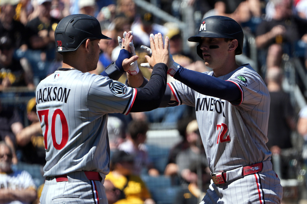 Minnesota Twins' Brooks Lee, right, is greeted by Alex Jackson (70) on his way back to the dugout after his two-run home run off Pittsburgh Pirates pitcher Braxton Ashcraft in the sixth inning of a baseball game in Pittsburgh, Sunday, May 31, 2026. (AP Photo/Tom E. Puskar)