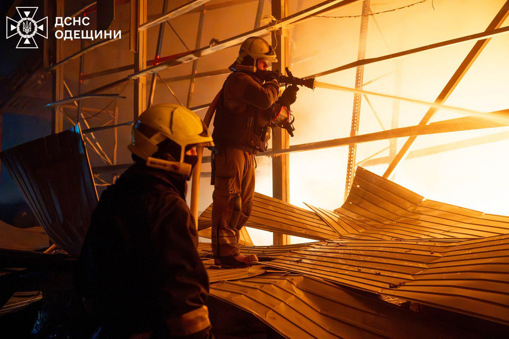 In this photo provided by the Ukrainian Emergency Service, emergency services personnel work to extinguish a fire following a Russian attack in Odesa region, Ukraine, Thursday, Jan. 29, 2026. (Ukrainian Emergency Service via AP)