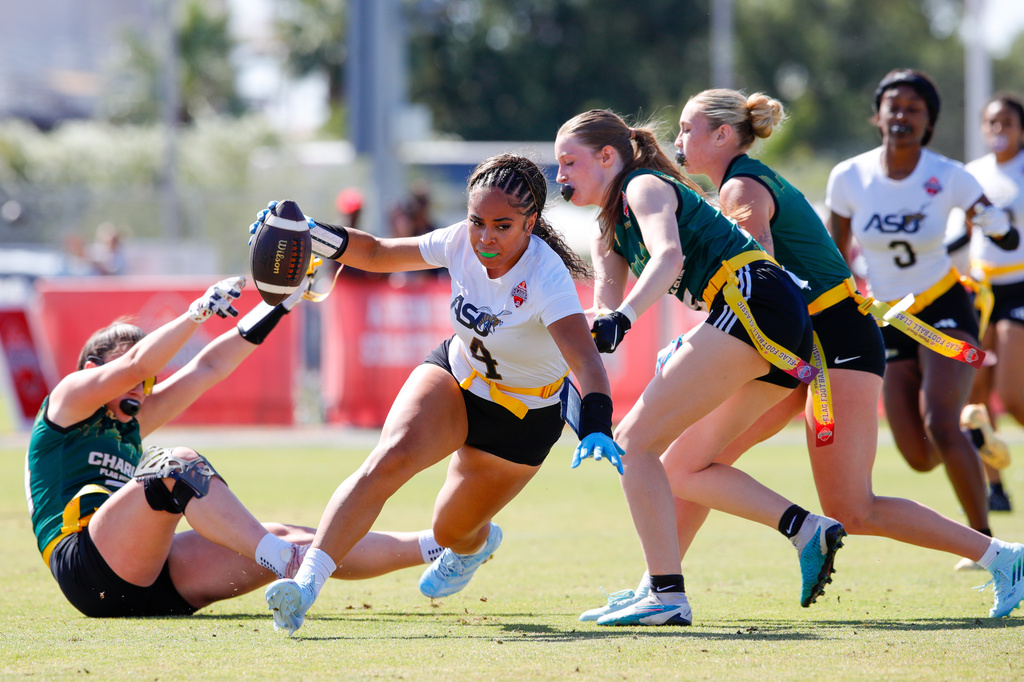 Alabama State's Kiona Westerlund evades defenders during the Fiesta Bowl Flag Football Classic on Sunday, April 19 in Tempe, Ariz. (Patty Kennedy/Fiesta Sports Foundation via AP)