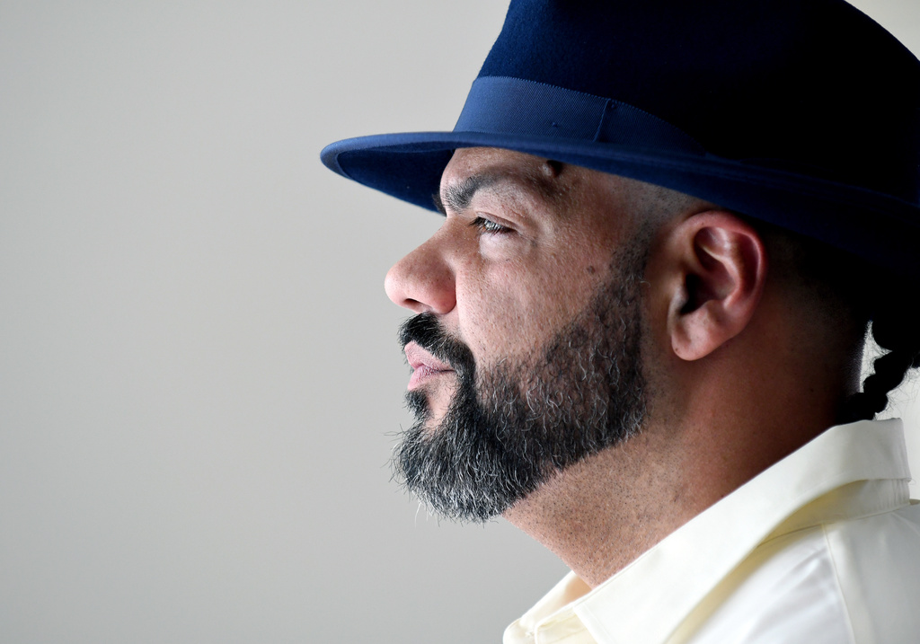 Derrick Johnson, whose mother's body was one of 189 left to decay in the Return to Nature Funeral Home in Penrose, Colo., poses for a portrait in Colorado Springs, Colo., on Thursday, Feb. 5, 2026. (AP Photo/Thomas Peipert)