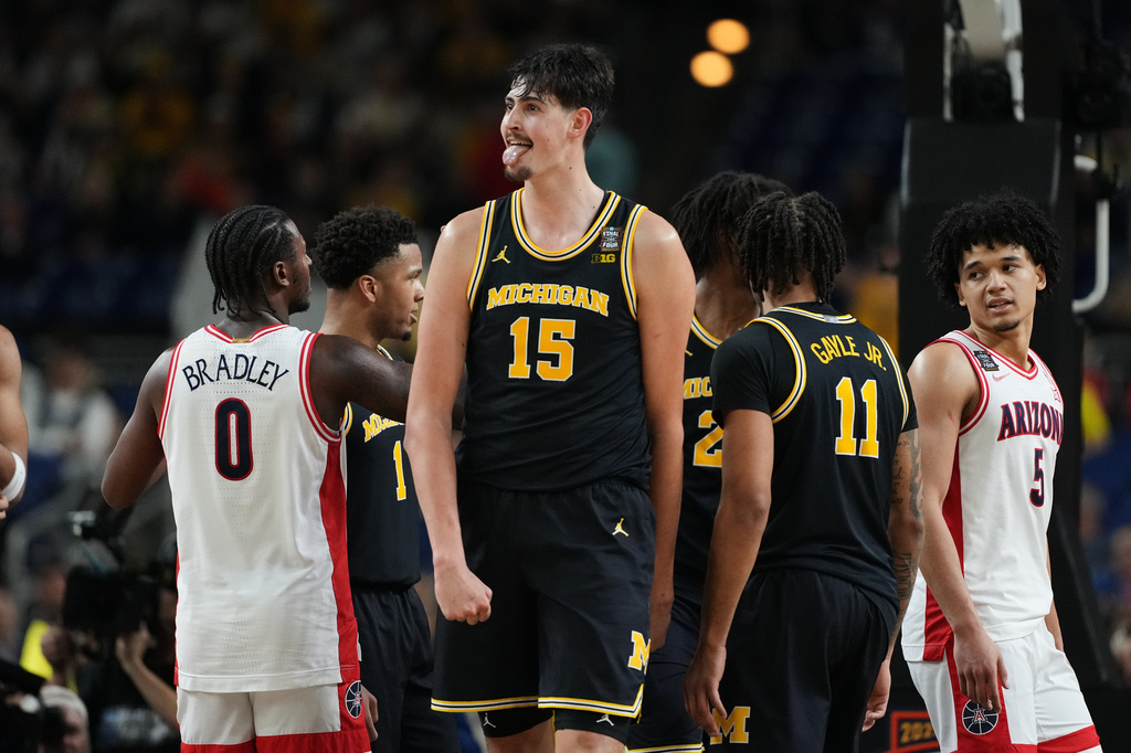 Michigan's Aday Mara (15) reacts during the second half of an NCAA college basketball tournament semifinal game against Arizona at the Final Four, Saturday, April 4, 2026, in Indianapolis. (AP Photo/Michael Conroy)