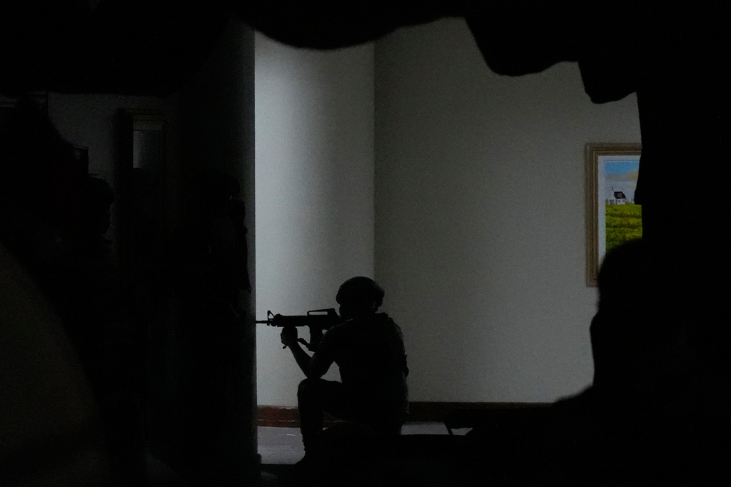 Philippine troopers secure an area after gunfire was heard at the Philippine Senate in Pasay, Philippines on Wednesday, May 13, 2026. (AP Photo/Aaron Favila)