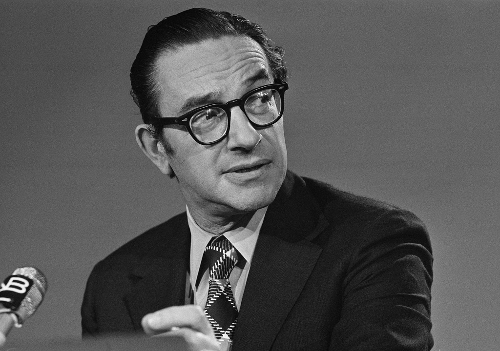 FILE - Alan Greenspan chairman of the Council of Economic Advisers, chats with newsmen prior to his appearance on NBC's "Meet the Press", Sept. 29, 1974, in Washington. (AP Photo/Bob Daugherty, file)