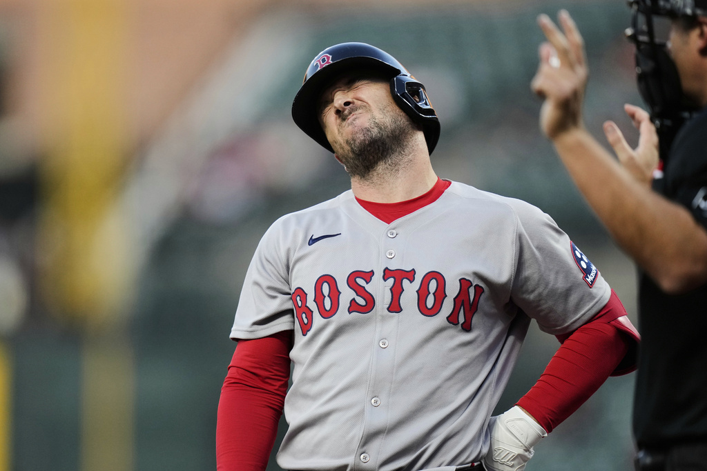 Boston Red Sox's Alex Bregman reacts after being hit by a pitch by Baltimore Orioles relief pitcher Roansy Contreras during the third inning of a baseball game, Wednesday, Aug. 27, 2025, in Baltimore. (AP Photo/Stephanie Scarbrough)