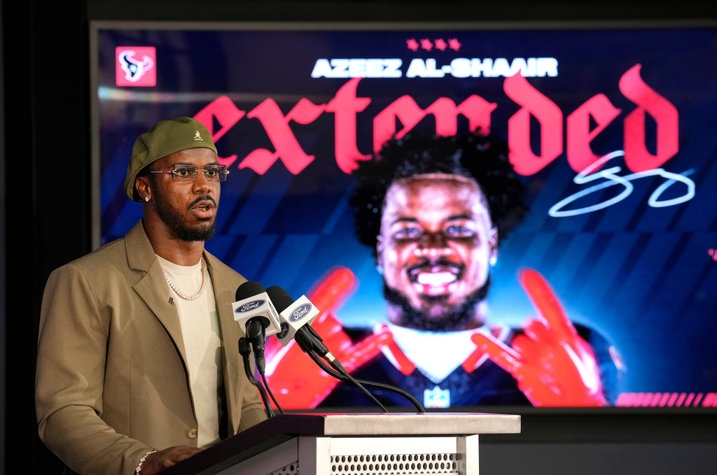 Houston Texans' Azeez Al-Shaair talks about his contract extension during a press conference at the NFL football team's facility, Friday, May 1, 2026, in Houston. (AP Photo/Karen Warren)