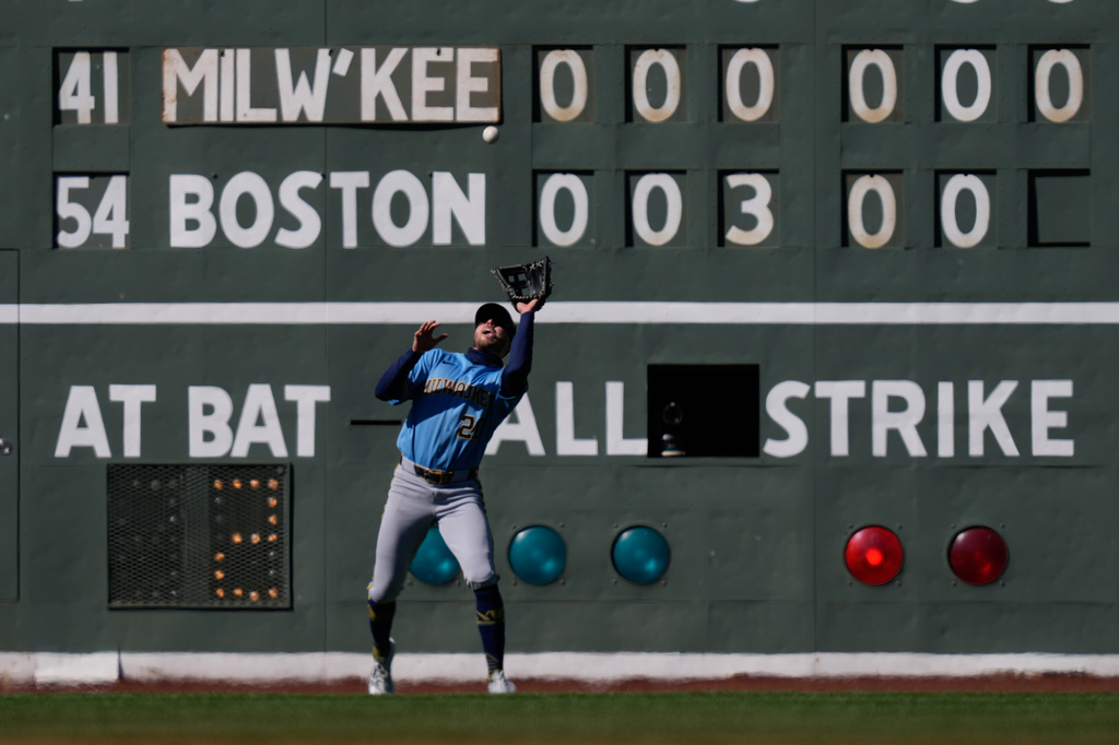 Milwaukee Brewers left fielder Brandon Lockridge fields a fly out by Boston Red Sox's Isiah Kiner-Falefa (2) during the sixth inning of a baseball game at Fenway Park, Wednesday, April 8, 2026, in Boston. (AP Photo/Charles Krupa)