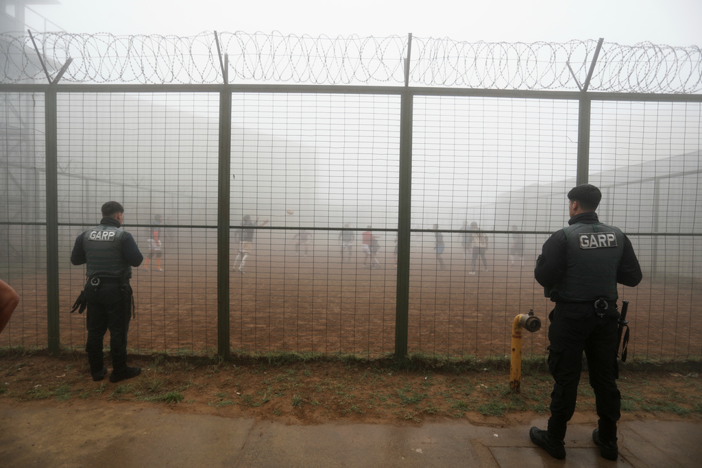 Prison guards watch inmates playing rugby at the Valparaiso Prison Complex in Valparaiso, Chile, as part of a social reintegration program, Thursday, Jan. 29, 2026. (AP Photo/Cristobal Escobar)