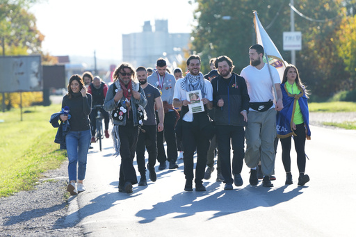 Students from southwestern town of Novi Pazar march on the road towards the northern city of Novi Sad, for a huge rally on Nov. 1 marking the first anniversary of a train station disaster that killed 16 people, in Ub, Serbia, Monday, Oct. 27, 2025. (AP Photo/Darko Vojinovic) Students from southwestern town of Novi Pazar march on the road towards the northern city of Novi Sad, for a huge rally on Nov. 1 marking the first anniversary of a train station disaster that killed 16 people, in Ub, Serbia, Monday, Oct. 27, 2025. (AP Photo/Darko Vojinovic)