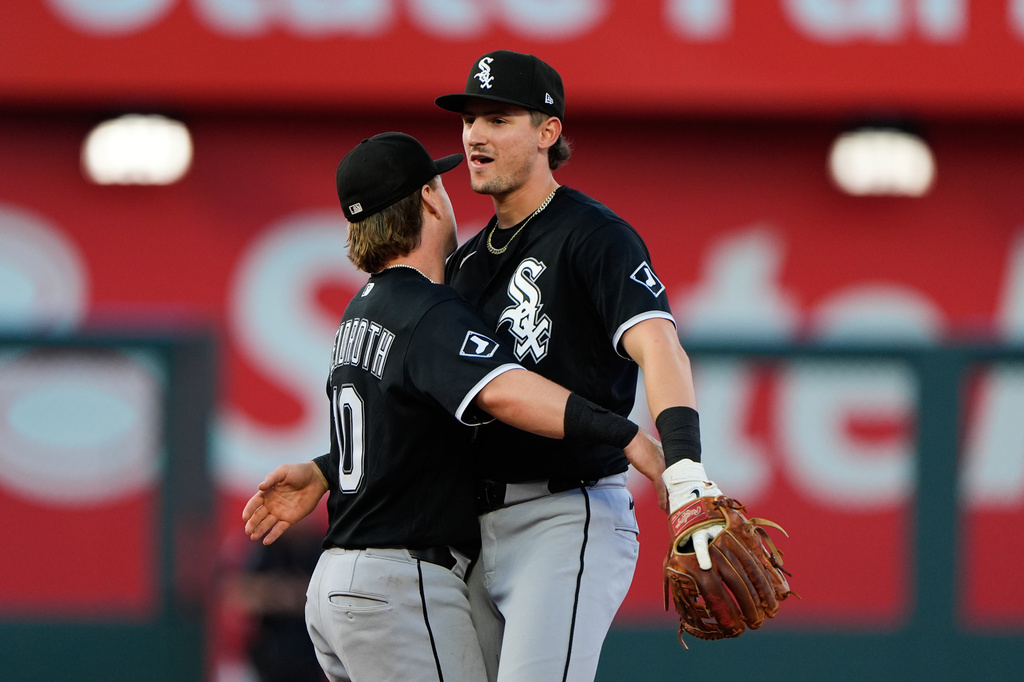 Chicago White Sox' Colson Montgomery, right, and Chase Meidroth (10) celebrate after their baseball game against the Kansas City Royals, Sunday, April 12, 2026, in Kansas City, Mo. (AP Photo/Charlie Riedel)