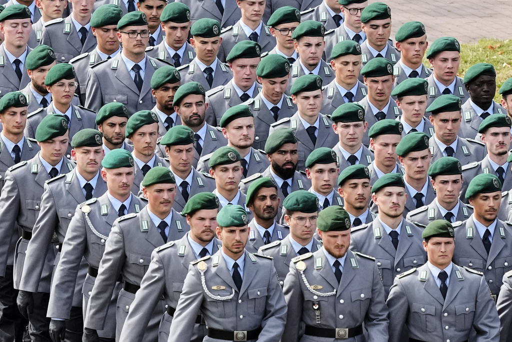 New recruits of the German Army Bundeswehr attend a ceremony to take their oath in front of the North Rhine-Westphalia state parliament in Duesseldorf, Germany, Thursday, Sept. 4, 2025. (AP Photo/Martin Meissner)