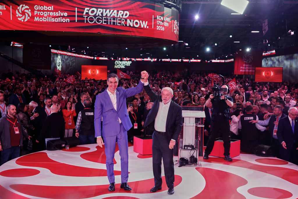 Spain's Prime Minister Pedro Sanchez, left, reacts next to Brazil's President Luiz Inacio Lula da Silva at the end of the Global Progressive Mobilisation summit in Barcelona, Spain, Saturday, April 18, 2026. (AP Photo/Joan Monfort)