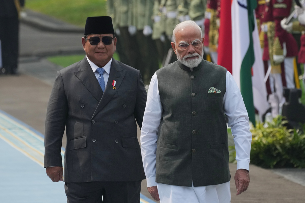 India's Prime Minister Narendra Modi, right, inspects honor guards with Indonesia's President Prabowo Subianto during the welcoming ceremony ahead of their meeting at Merdeka Palace in Jakarta, Indonesia, Tuesday, July 7, 2026. (AP Photo/Achmad Ibrahim)