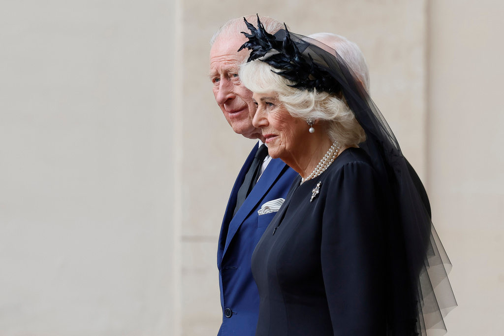 Britain's Queen Camilla, foreground arrives with King Charles III in the St. Damasus Courtyard at the Vatican for a state visit, where they will meet with Pope Leo XIV and pray with him in the Sistine Chapel, Thursday, Oct. 23, 2025. (Cecilia Fabiano/LaPresse via AP)