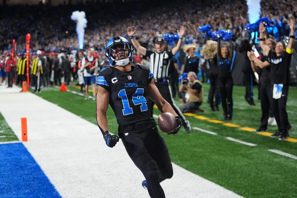 Detroit Lions wide receiver Amon-Ra St. Brown (14) celebrates his touchdown against the Tampa Bay Buccaneers during the first half of an NFL football game, Monday, Oct. 20, 2025, in Detroit. AP Photo/Paul Sancya)