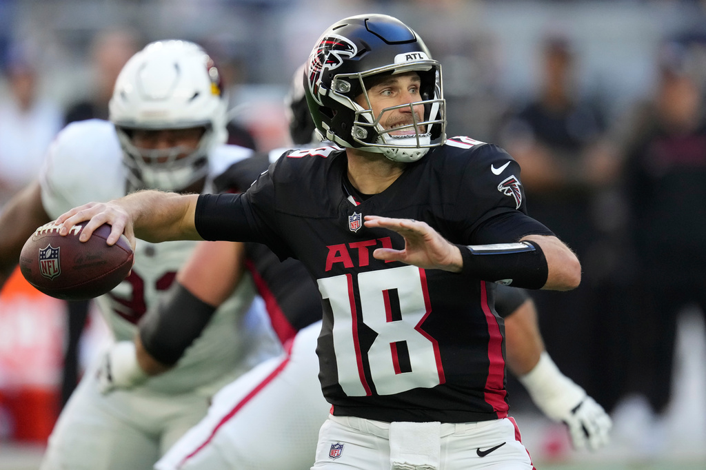 FILE - Atlanta Falcons quarterback Kirk Cousins throws against the Arizona Cardinals during the first half of an NFL football game, Dec. 21, 2025, in Glendale, Ariz. (AP Photo/Ross D. Franklin, File)