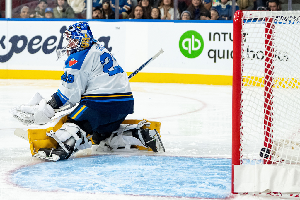 Toronto Sceptres goaltender Elaine Chuli (29) fails to stop the puck, allowing a score by Vancouver Goldeneyes' Sarah Nurse during the third period of a PWHL hockey game in Vancouver, British Columbia, Thursday, Jan. 22, 2026. (Ethan Cairns/The Canadian Press via AP)