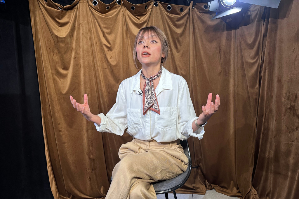 Shiva Amini, a former Iranian women's soccer player, speaks while giving an interview at The Associated Press office in New York, Tuesday, March 17, 2026. (AP Photo/Philip Marcelo)