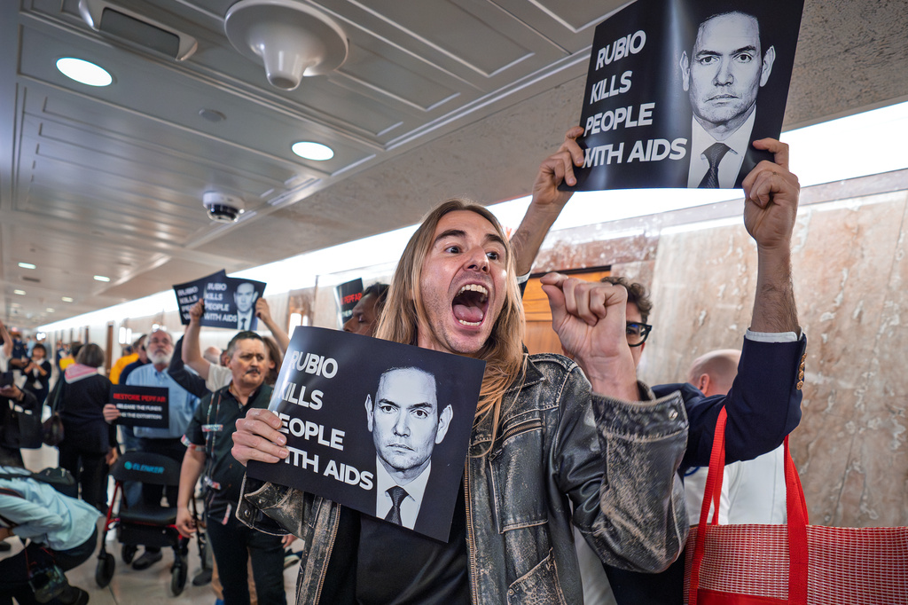 Anti-war demonstrators try to disrupt the Senate Foreign Relations Committee hearing with Secretary of State Marco Rubio, at the Capitol in Washington, Tuesday, June 2, 2026. (AP Photo/J. Scott Applewhite)