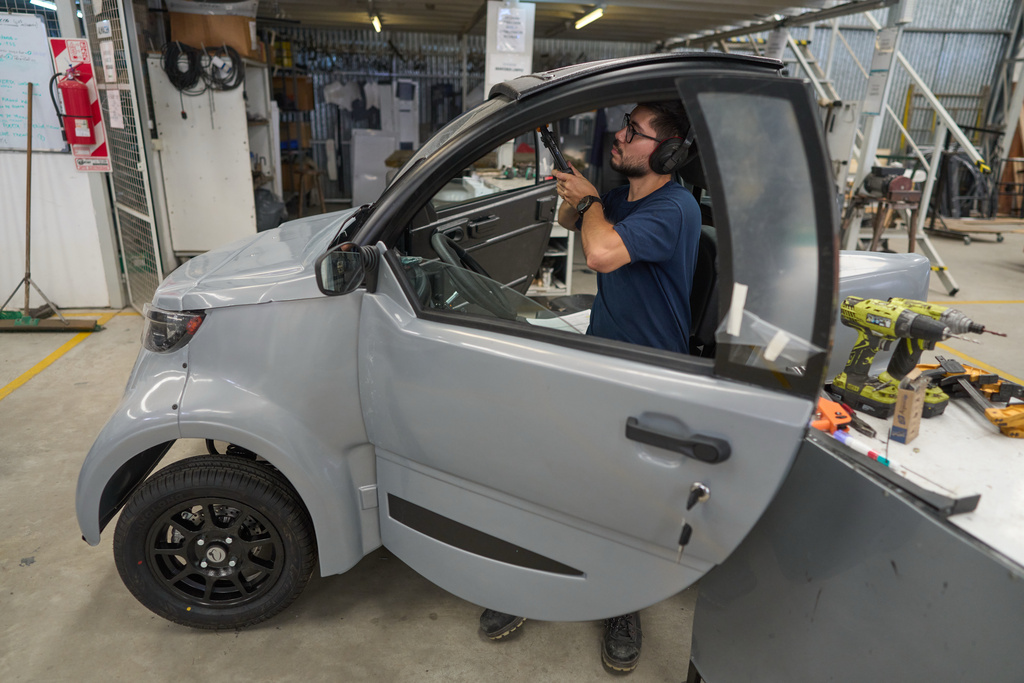 Ignacio Palacios works on a Sero Electric microcar at its factory in Castelar, Argentina, Wednesday, Jan. 21, 2026. (AP Photo/Victor R. Caivano)
