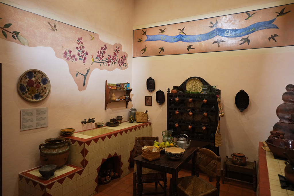 Murals created by Frida Kahlo, inspired by the plants found in the garden, adorn the kitchen of the new museum Casa Kahlo, a house bought by Kahlo’s father after he gave the iconic Casa Azul to his daughter as a wedding gift, in Mexico City, Wednesday, Sept. 10, 2025. (AP Photo/Eduardo Verdugo)
