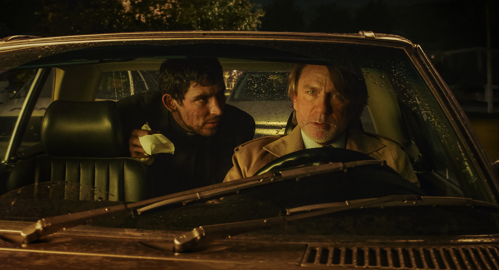 This image released by Netflix shows Josh O'Connor, left, and Daniel Craig in a scene from "Wake Up Dead Man: A Knives Out Mystery." (Netflix via AP)
