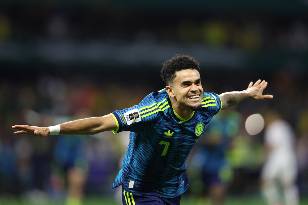Colombia's Luis Diaz (7) celebrates after scoring his team's second goal during the World Cup Group K soccer match between Uzbekistan and Colombia in Mexico City, Wednesday, June 17, 2026. (AP Photo/Ashtin Barker)