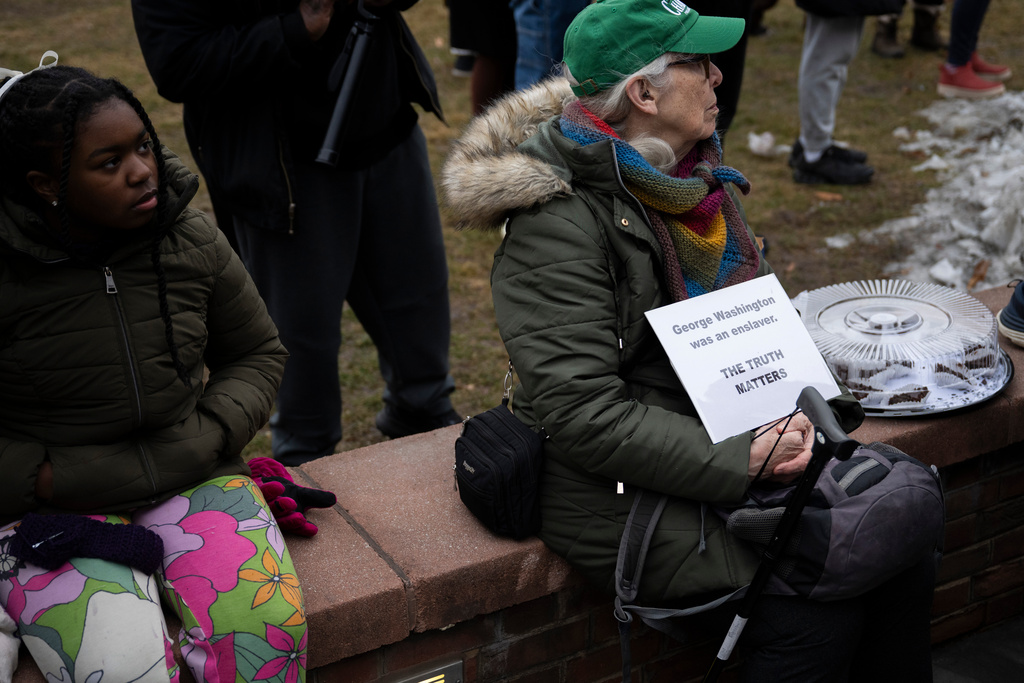 Attendees gather for a rally celebrating the reinstallation of a slavery exhibit at the President's House Site in Philadelphia on Thursday, Feb. 19, 2026, in Philadelphia. (AP Photo/Joe Lamberti)