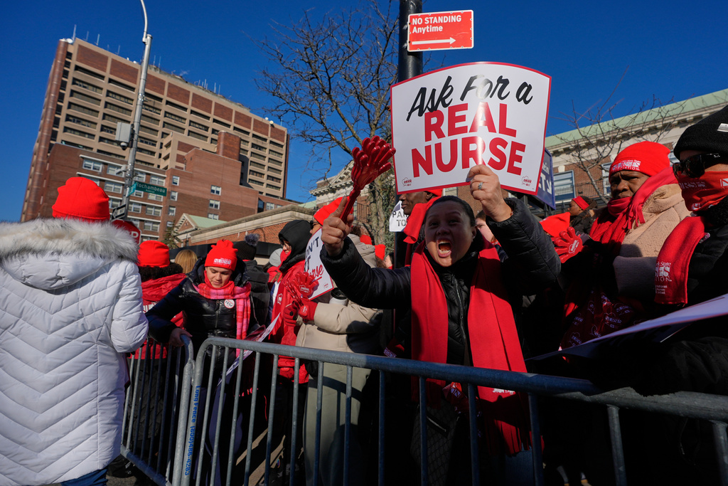 Nurses strike in front of Montefiore Hospital in the Bronx borough of New York, Tuesday, Jan. 13, 2026. (AP Photo/Seth Wenig)