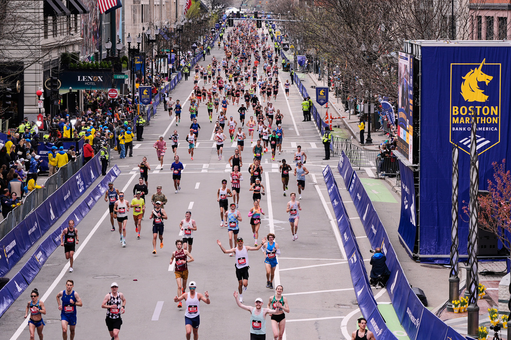 Runners stride down Boylston Street while approaching the finish line of the Boston Marathon, Monday, April 20, 2026, in Boston. (AP Photo/Charles Krupa)