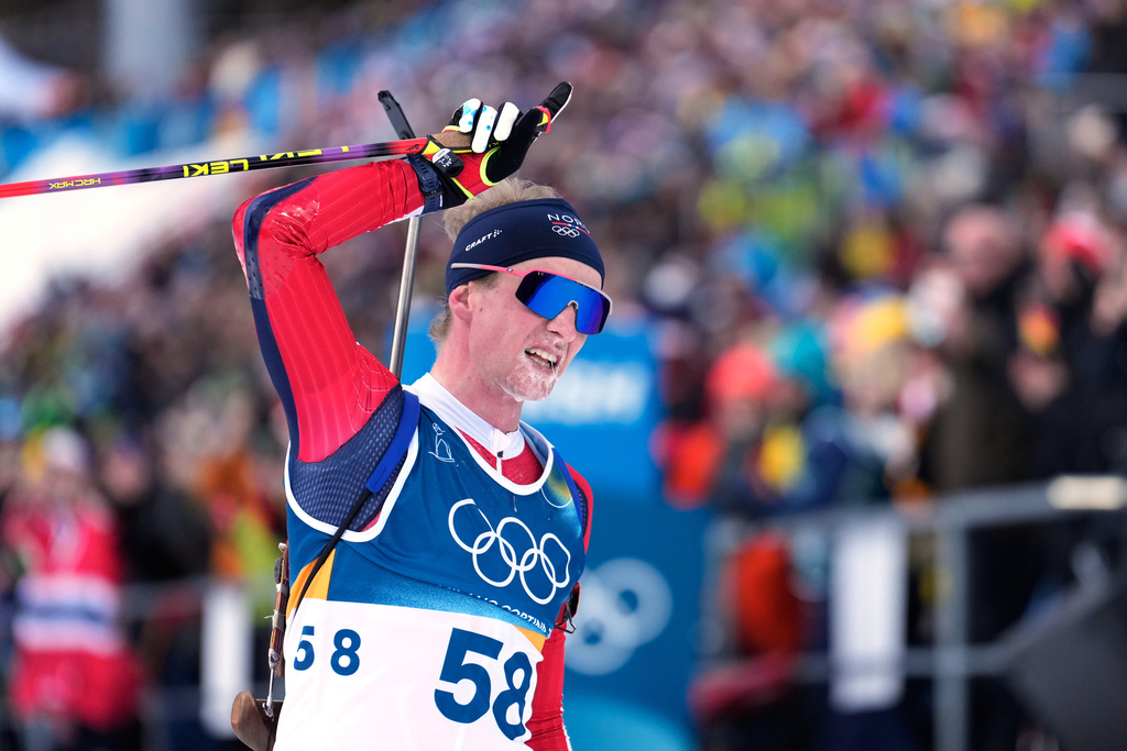 Johan-Olav Botn, of Norway, reacts after crossing the finish line in the men's 20-kilometer individual biathlon race at the 2026 Winter Olympics in Anterselva, Italy, Tuesday, Feb. 10, 2026. (AP Photo/Mosa'ab Elshamy)