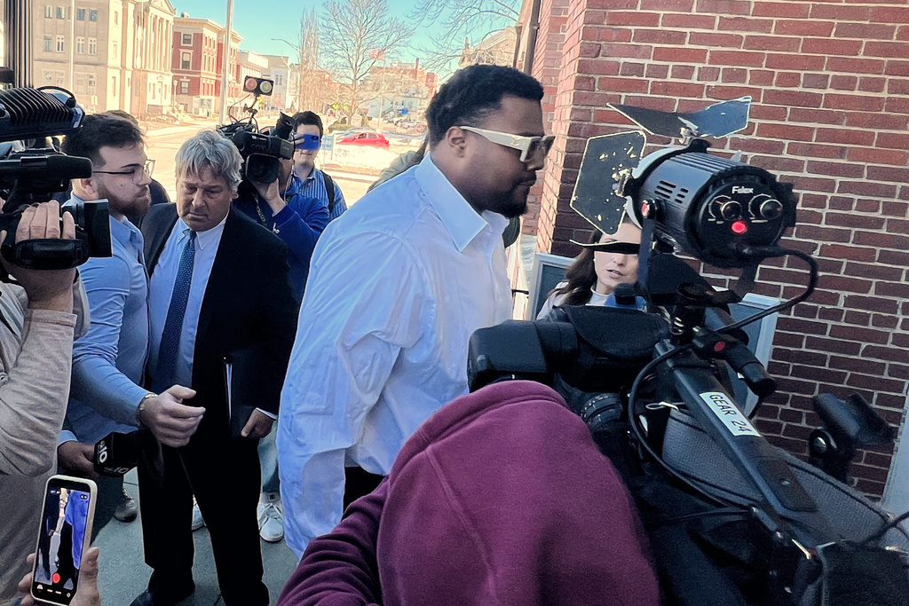 New England Patriots defensive lineman Christian Barmore arrives at Attleboro District Court for his arraignment on a domestic assault and battery charge Monday, March 9, 2026, in Attleboro, Mass. (AP Photo/Kimberlee Kruesi)