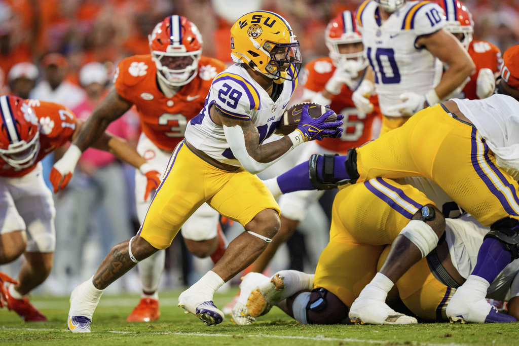 LSU running back Caden Durham (29) runs with the ball in the first half of an NCAA college football game against Clemson, Saturday, Aug. 30, 2025, in Clemson, S.C. (AP Photo/Jacob Kupferman)