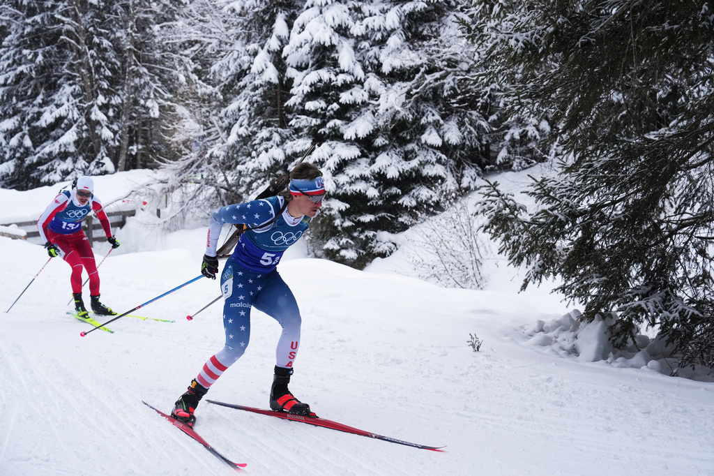 FILE - Campbell Wright, of the United States, right, competes in the men's 4x7.5-kilometer relay biathlon race at the 2026 Winter Olympics in Anterselva, Italy, Feb. 17, 2026. (AP Photo/Andrew Medichini, File)