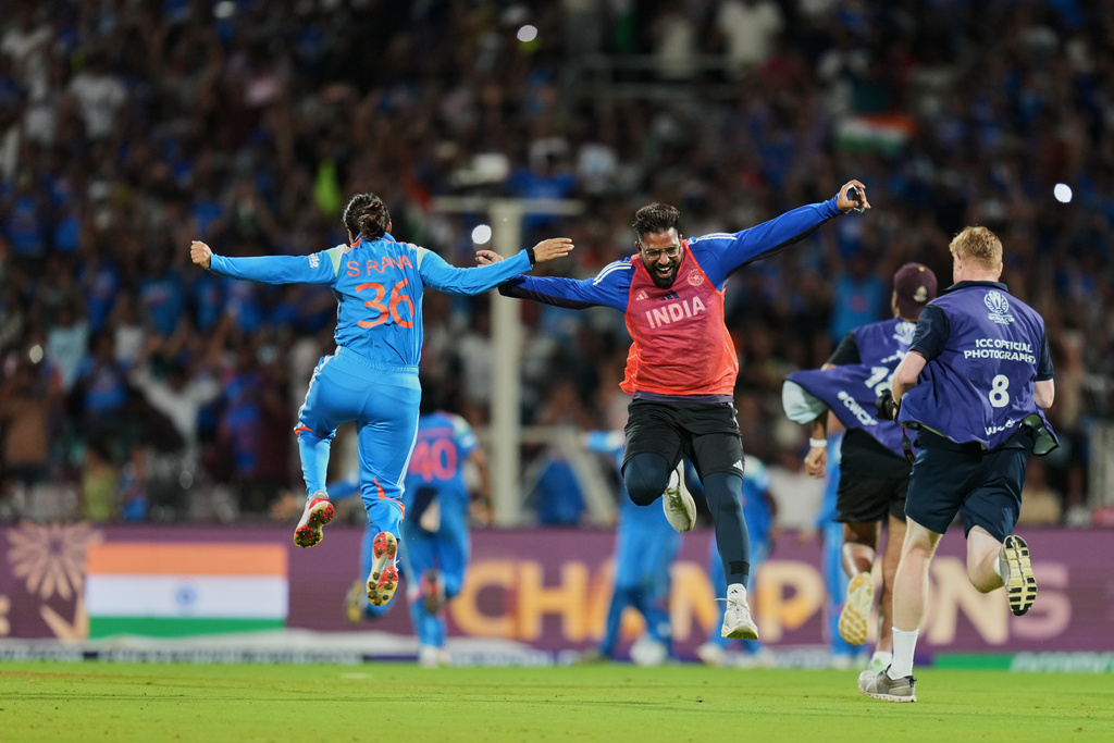 India's Sneh Rana and a team support staff celebrate after winning the ICC Women's Cricket World Cup final match between India and South Africa in Navi Mumbai, India, Sunday, Nov. 2, 2025. (AP Photo/Rafiq Maqbool)