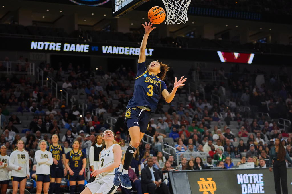 Notre Dame guard Hannah Hidalgo (3) shoots after getting past Vanderbilt guard Aubrey Galvan, left, in the second half in the Sweet 16 of the NCAA college basketball tournament, Friday, March 27, 2026, in Fort Worth, Texas. (AP Photo/LM Otero)