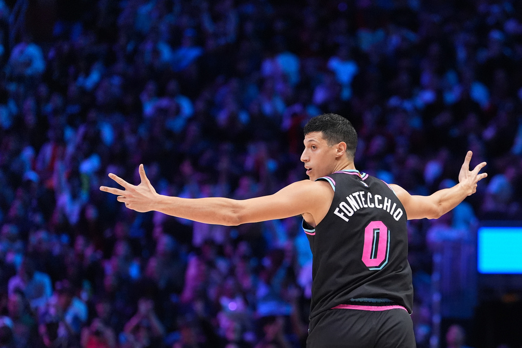 Miami Heat forward Simone Fontecchio (0) celebrates hitting a three-point shot during the first half of an NBA basketball game against the Oklahoma City Thunder, Saturday, Jan. 17, 2026, in Miami. (AP Photo/Rebecca Blackwell)
