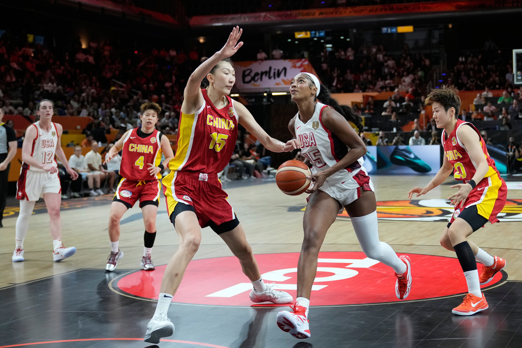 China's Han Xu guards United States' Angel Reese during the Women's Basketball World Cup match between China and the United States in Berlin, Friday, Sept. 4, 2026. (AP Photo/Ebrahim Noroozi)