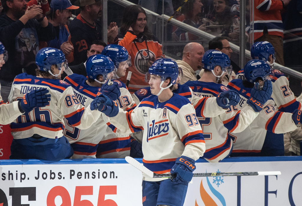 Edmonton Oilers' Ryan Nugent-Hopkins (93) celebrates after a goal against the Winnipeg Jets during first-period NHL hockey game action in Edmonton, Alberta, Saturday, Dec. 6, 2025. (Jason Franson/The Canadian Press via AP)