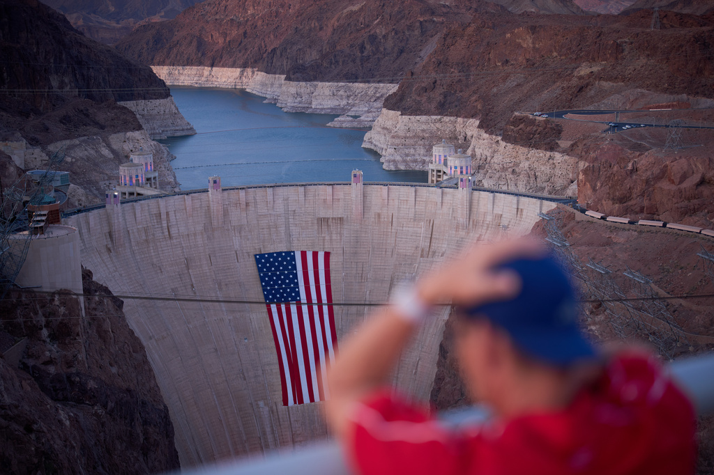 A bathtub ring of light minerals shows the high water line of Lake Mead near the Hoover Dam at the Lake Mead National Recreation Area Tuesday, June 30, 2026, near Boulder City, Nev. (AP Photo/John Locher)