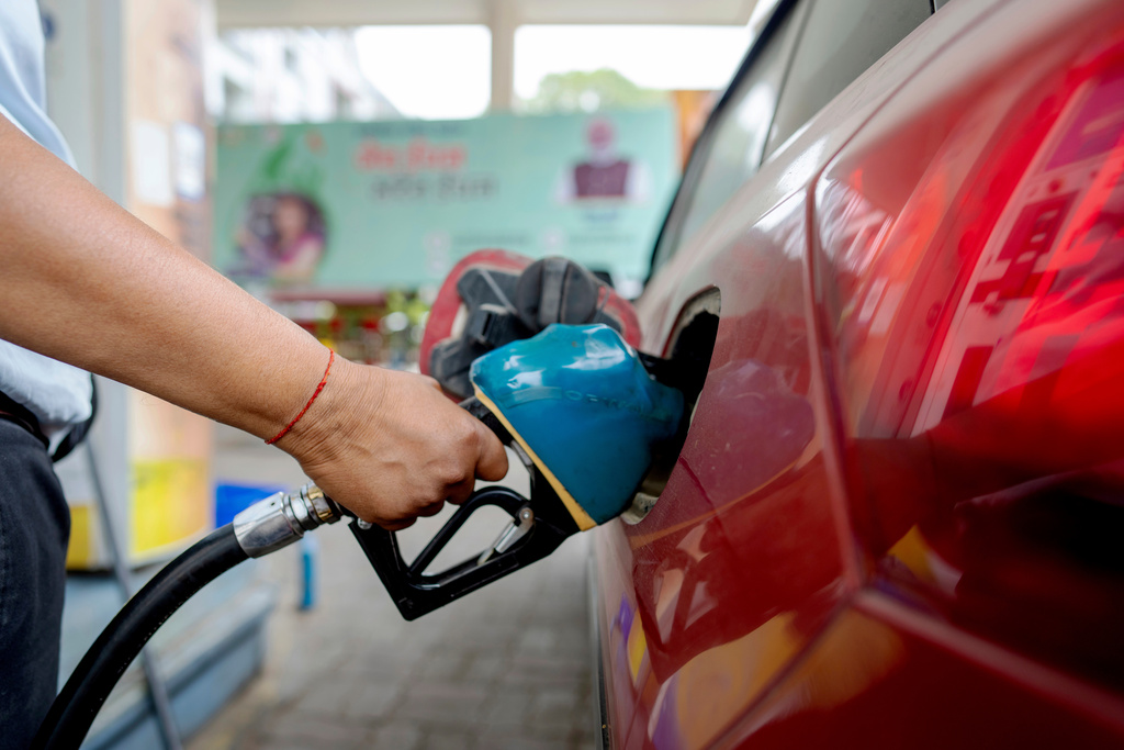 FILE - An Indian man fills petrol at a fuel pump in Prayagraj, in the northern Indian state of Uttar Pradesh, May 5, 2025. (AP Photo/Rajesh Kumar Singh, File)