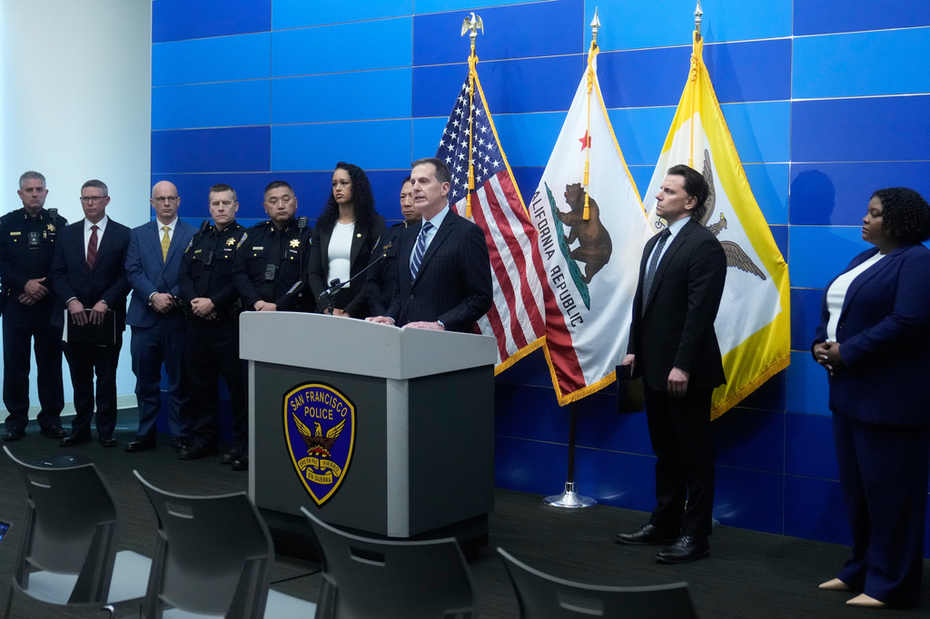 Craig Missakian, U.S. Attorney, Northern District of California, middle, speaks during a news conference Monday, April 13, 2026, in San Francisco. (AP Photo/Jeff Chiu)