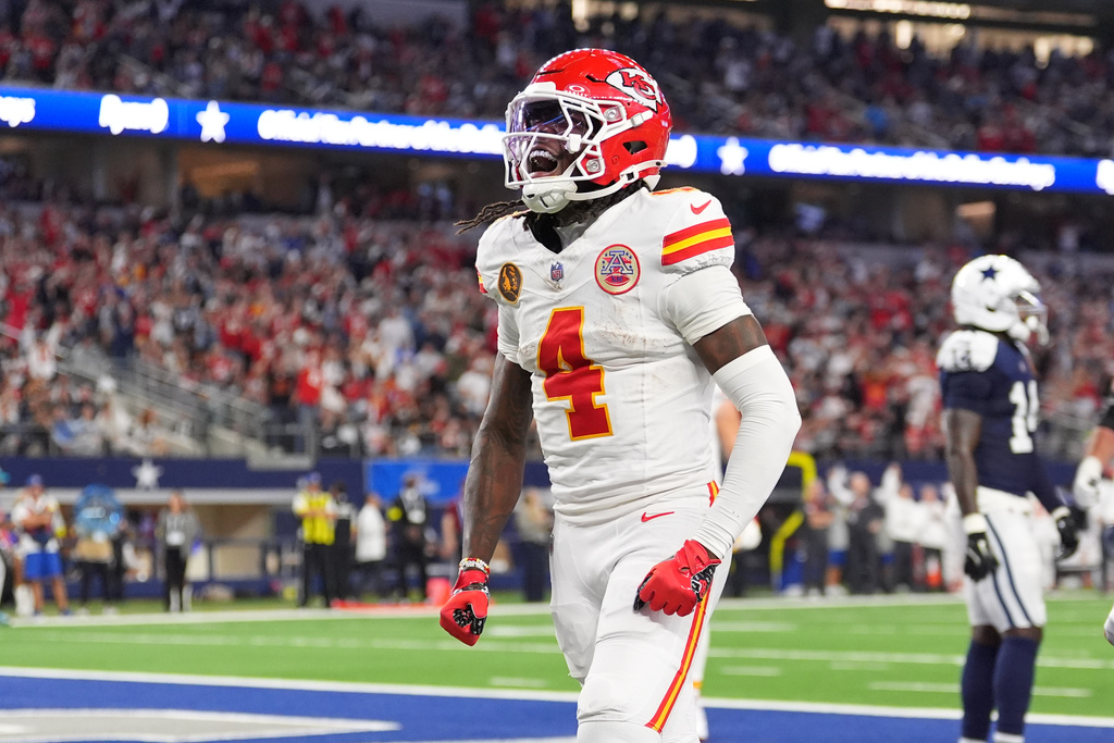 Kansas City Chiefs wide receiver Rashee Rice (4) celebrates after scoring during the second half of an NFL football game against the Dallas Cowboys Thursday, Nov. 27, 2025, in Arlington, Texas. (AP Photo/Tony Gutierrez)