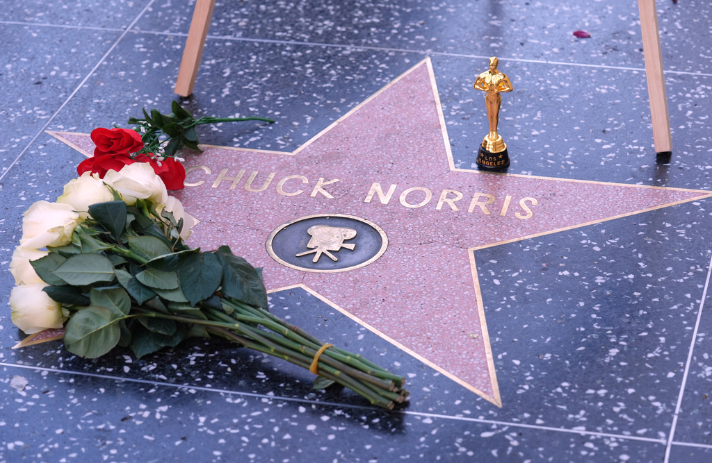 A toy Oscar is left on the Hollywood Walk of Fame star of the late actor Chuck Norris, who died Thursday at 86, Friday, March 20, 2026, in Los Angeles. (AP Photo/Chris Pizzello)