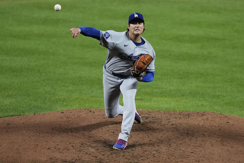 Los Angeles Dodgers starting pitcher Shohei Ohtani delivers during the third inning of a baseball game against the Baltimore Orioles, Friday, Sept. 5, 2025, in Baltimore. (AP Photo/Stephanie Scarbrough)