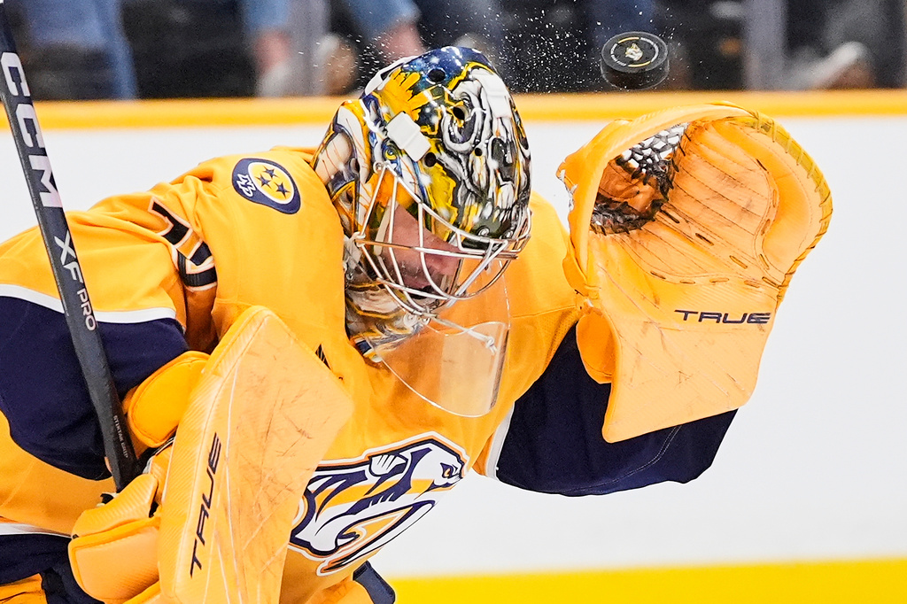 Nashville Predators goaltender Juuse Saros (74) deflects a shot on goal during the third period of an NHL hockey game against the Colorado Avalanche, Tuesday, Dec. 9, 2025, in Nashville, Tenn. (AP Photo/George Walker IV)