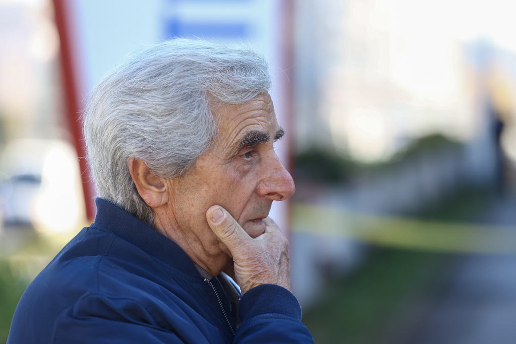 A man reacts as he stands in front of a retirement home following a major fire that killed at least 11 people in Tuzla, Bosnia, Tuesday, Nov. 5, 2025. (AP Photo)
