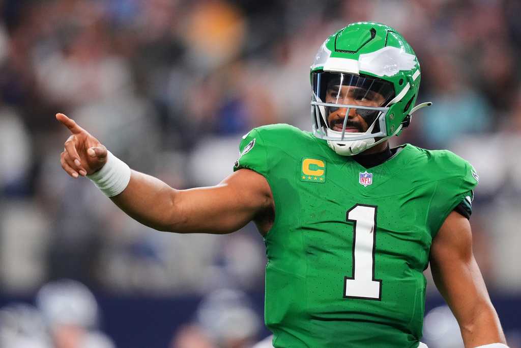 Philadelphia Eagles quarterback Jalen Hurts (1) reacts during the first half of an NFL football game against the Dallas Cowboys, Sunday, Nov. 23, 2025, in Arlington, Texas. (AP Photo/Julio Cortez)