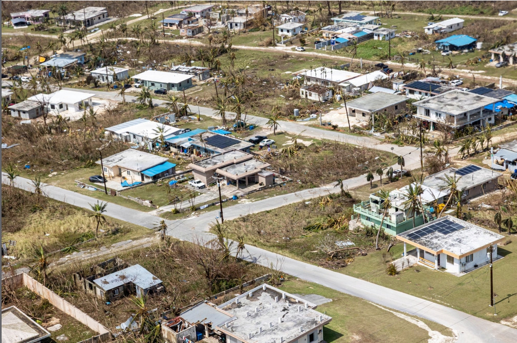 This photo provided by U.S. Marine Corps, debris covers homes and streets following Super Typhoon Sinlaku on the island of Saipan, April 18, 2026. (Cpl. Avery Wayland/U.S. Marine Corps via AP)